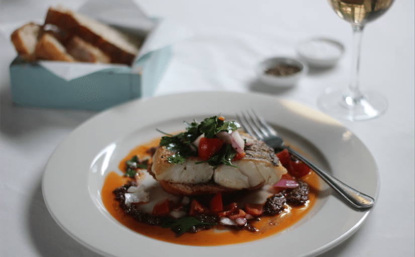 Grilled Hake on Tapenade Toast with Tomato and Parsley Salad